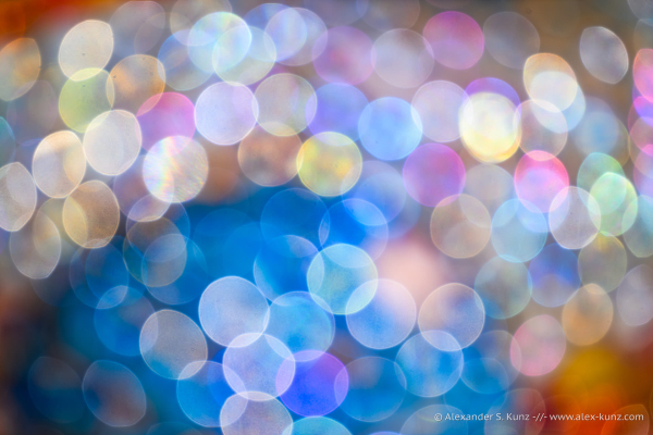 An abstract photo showing overlapping colorful circles of lens blur over the entire frame.