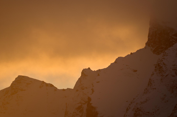 Cloud and sunlight breaking on the mountain ridge