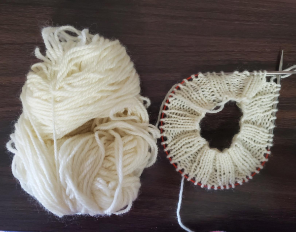 Same knitwork alongside ball of yarn