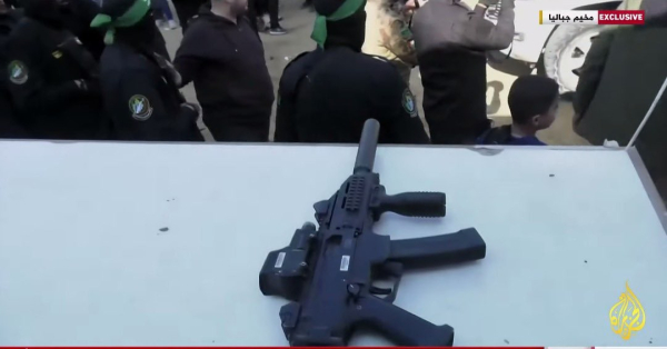 Suppressed submachine gun. Possibly a Micro Galil variant