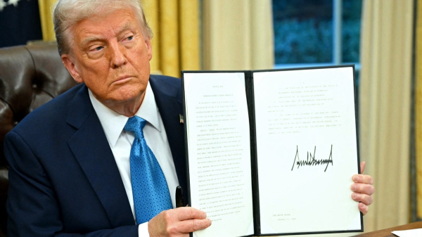 Photo of trump. Who knew he could hold a pen?