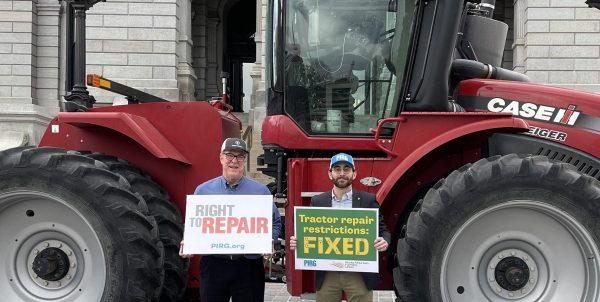 Colorado agricultural right to repair passed - next to a big red tractor.