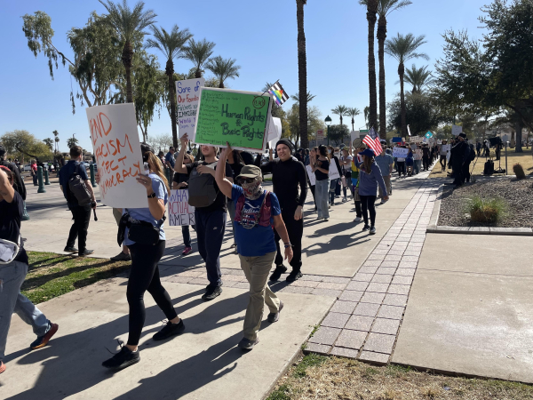 More protestors waking with signs. 