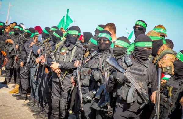 Hamas terrorists seen before a hostage release in Gaza City, February 1, 2025 (credit: Ali Hassan/Flash90)