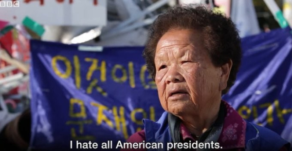 An elderly Korean woman giving an interview with the BBC. Caption: "I hate all American presidents." 