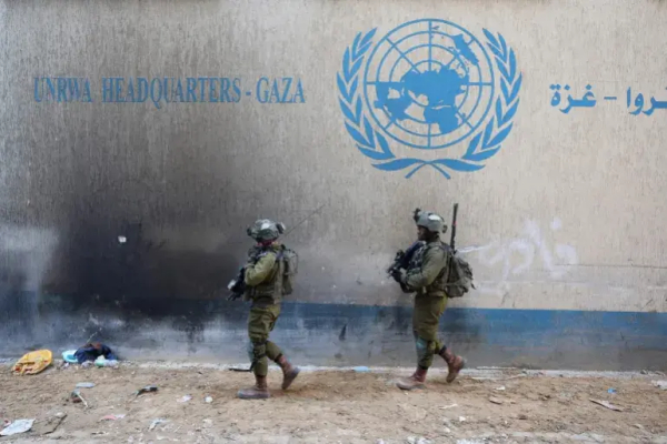 Israeli soldiers inside an evacuated compound of the UN Relief and Works Agency for Palestine Refugees in Gaza City on February 8, 2024 [Jack Guez/AFP]