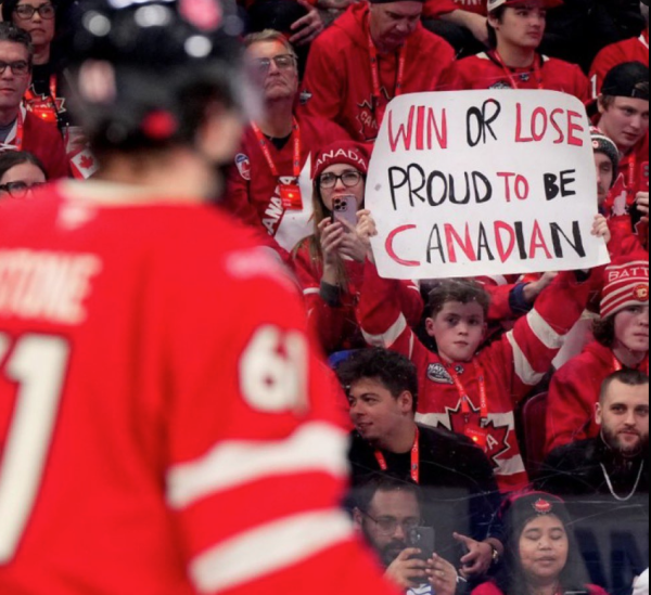 Child holding up sign during Canada vs. USA in 4 Nations hockey face-off finals in Boston (Feb 20, 2025):

"Win or Lose: Proud to be Canadian"