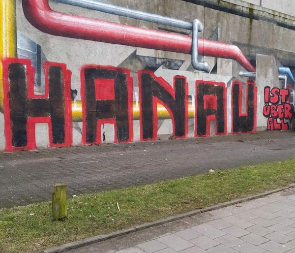 "Hanau ist uberall" painted on a wall with spray paint 