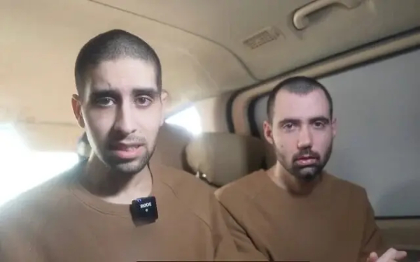 Hostages Eviatar David (left) and Guy Gilboa-Dalal speak in a Hamas propaganda video filmed at the site and time of the release ceremony in Gaza for three other captives, February 22, 2025. (Screenshot: Telegram)