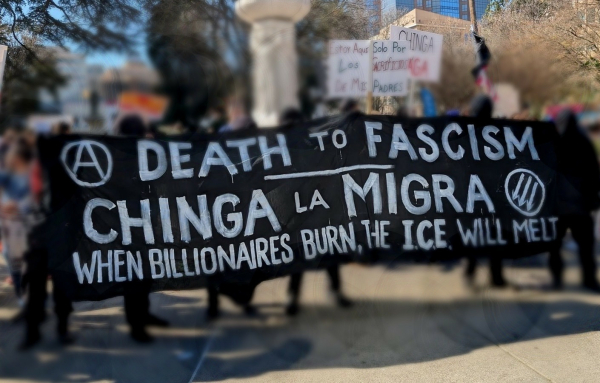 Banner reading, "Death to fascism, Chinga La Migra, When Billionaires Burn, the ICE Will Melt"