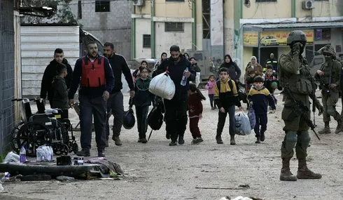 Residents of the Al-Fara refugee camp forcefully displaced by Israel occupation forces, in February.Credit: Majdi Mohammed/AP