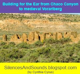 Building for the Ear (from Chaco Canyon to Medieval Vorarlberg) (2/23/25). Image is of the ruins situated against the hilly landscape with rock and desert scrub.