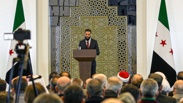 Syrian interim President Ahmed al-Sharaa delivers a speech during the Syrian National Dialogue Conference in Damascus, Syria