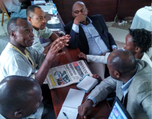 Journalists in Tanzania discussing a breaking news story – image by David Brewer of MHM via Creative Commons