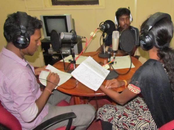 Student journalists in Jaffna, Sri Lanka, learning how to broadcast original news stories which they have produced. Photograph by David Brewer of Media Helping Media.