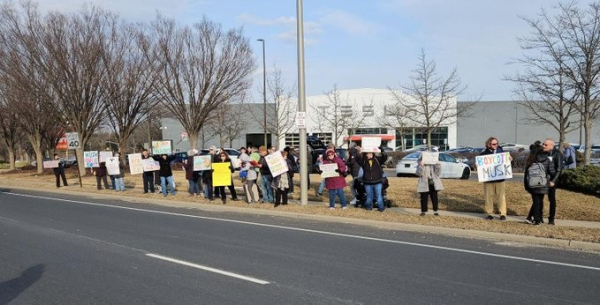 Protesters outside a Swasticar factory in New York