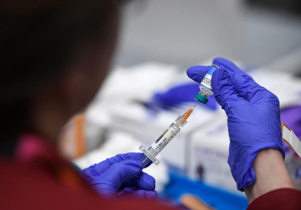 A health worker preps a MMR vaccine in Lubbock, Texas, on 1 March.
Photograph: Annie Rice/EPA