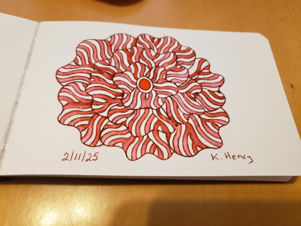 Hand drawn generative/procedural art in ink on an open page of my sketchbook. The abstract pattern is floral.