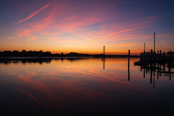 The sun has set over the Beaufort, NC waterfront on a winter evening. The still water reflects the sky.
© Tom Goetz. All rights reserved. Training an AI on this image is expressly forbidden.