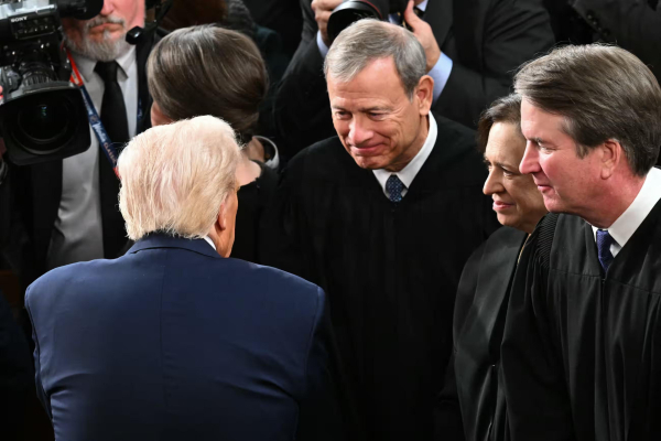 Donald Trump greets John Roberts after speaking to a joint session of Congress on 4 March 2025.
Photograph: Saul Loeb/AFP/Getty Images