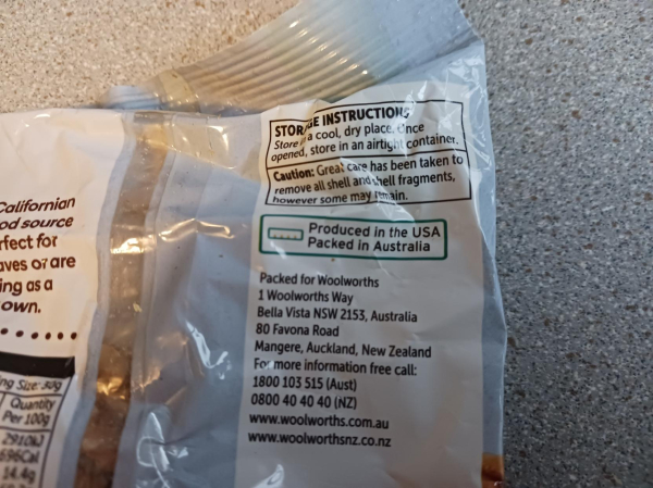 back of Woolworths brand walnuts, showing 'Produced in the USA. Packed in Australia'