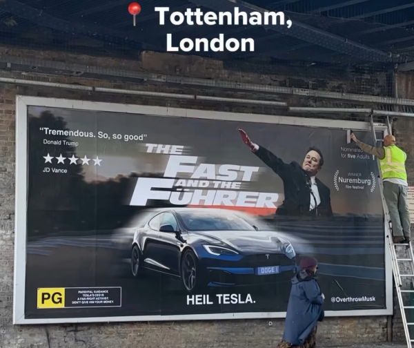 Sign on a poster board that says "The Fast and The Fuhrer" "Heil Tesla" and a man who appears to be doing a Nazi salute, next to a car.

Fake movie poster
