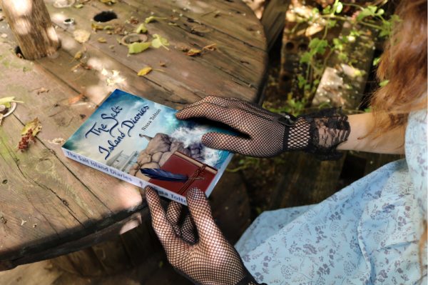 Woman holding a copy of The Salt Island Diaries