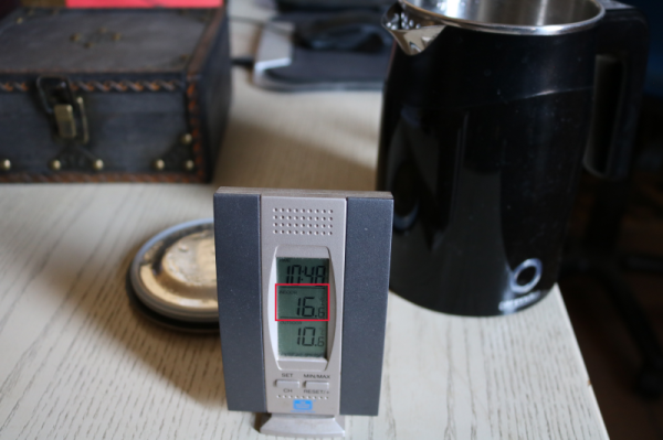 electronic thermometer showing 16° indoor temperature