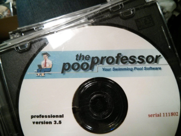 old cd in its case 
The art on the cd shows a man wearing a red tie using a very tiny computer, with the label: the poo professor [sic] Your Swimming Pool Software. Professional version 3.5